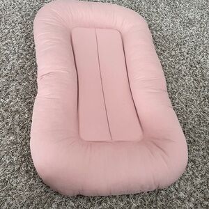 Infant support cushion.